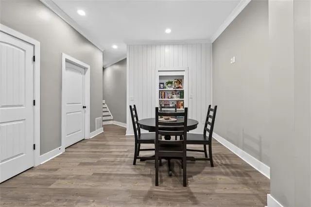 a view of a living room with a potted plant and a floor to ceiling window