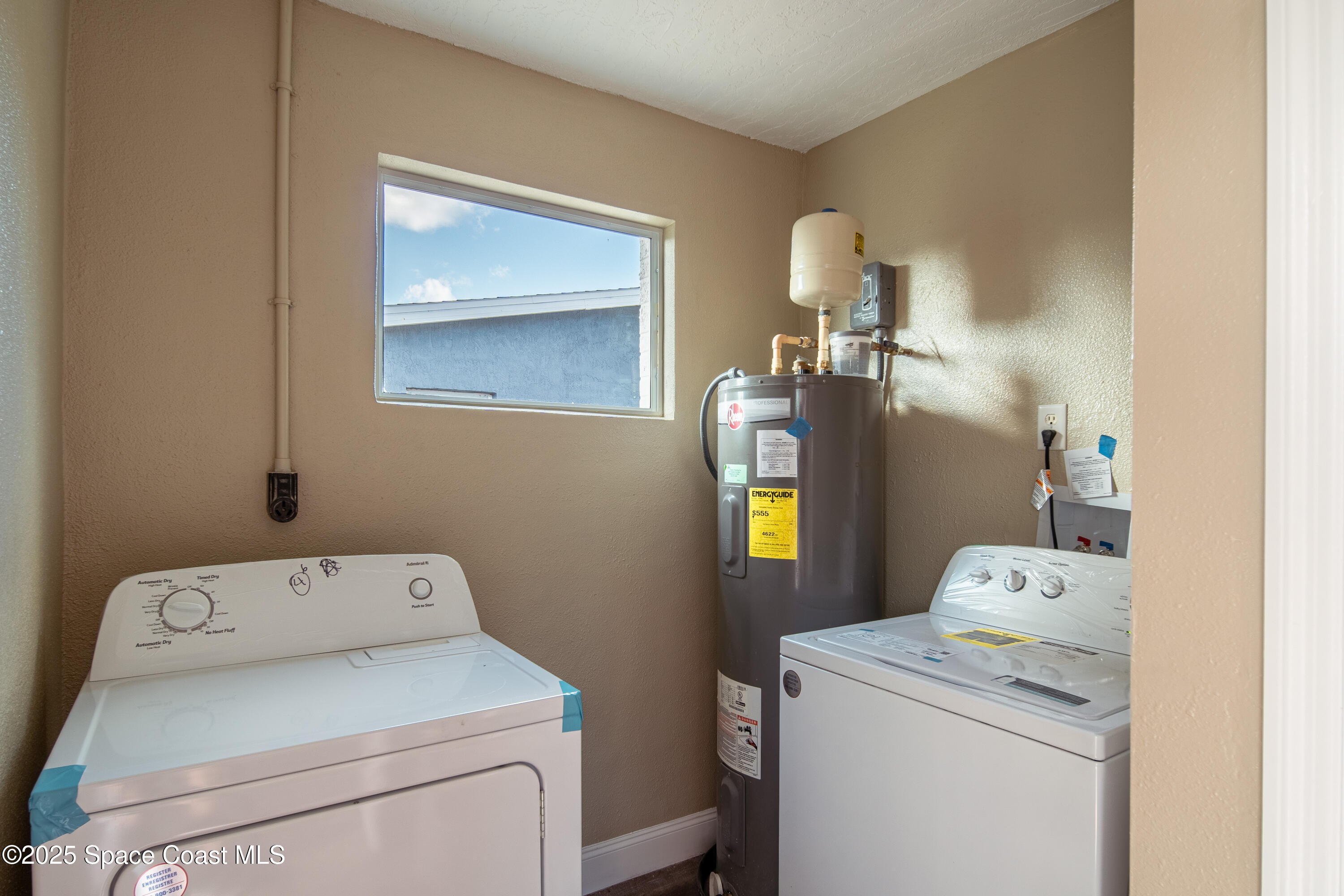 1705 Sarno Acc Melbourne, FL 32935 - Photo 21 of 40 a utility room with dryer and washer