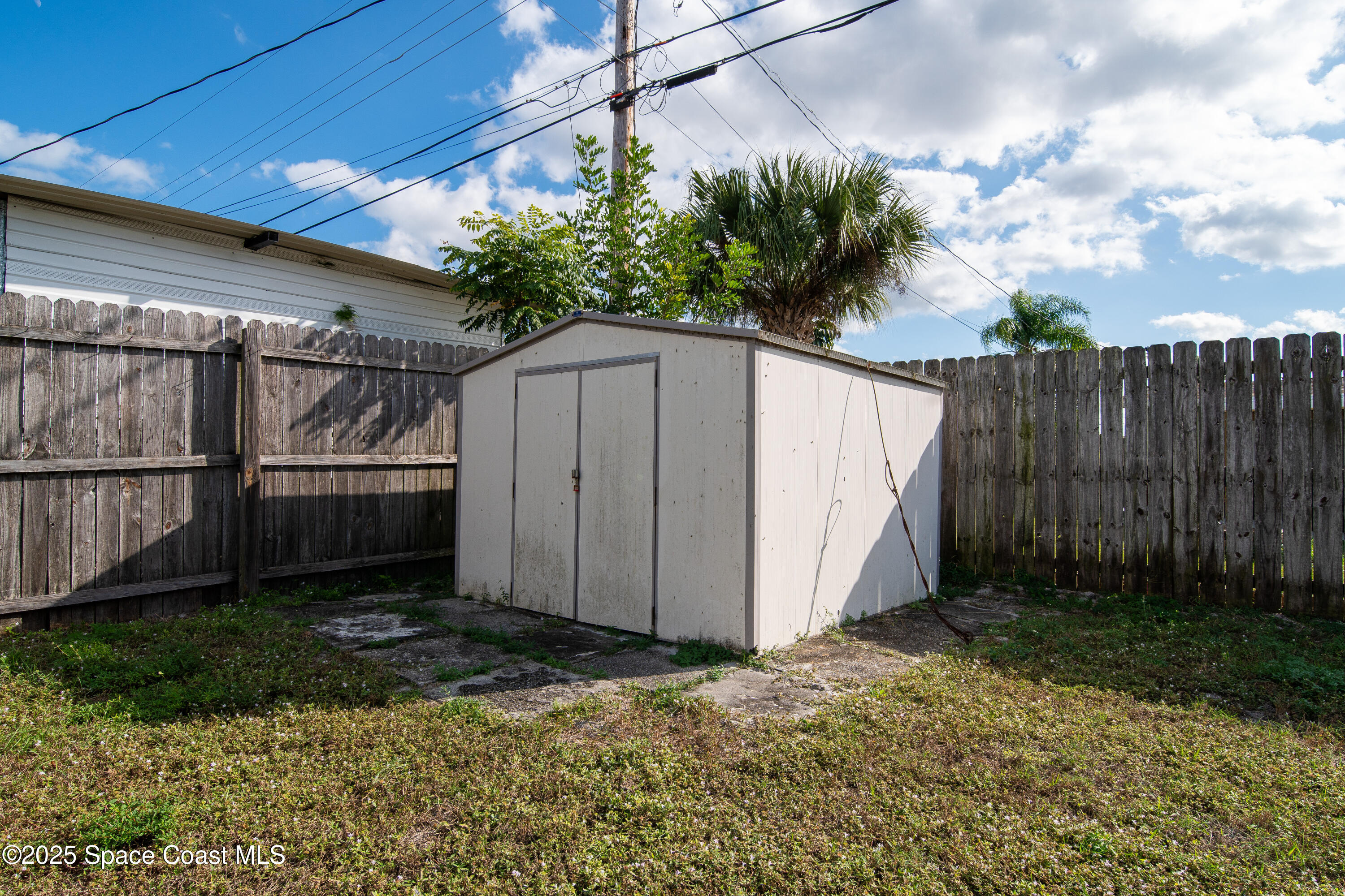 1705 Sarno Acc Melbourne, FL 32935 - Photo 23 of 40 a backyard of a house