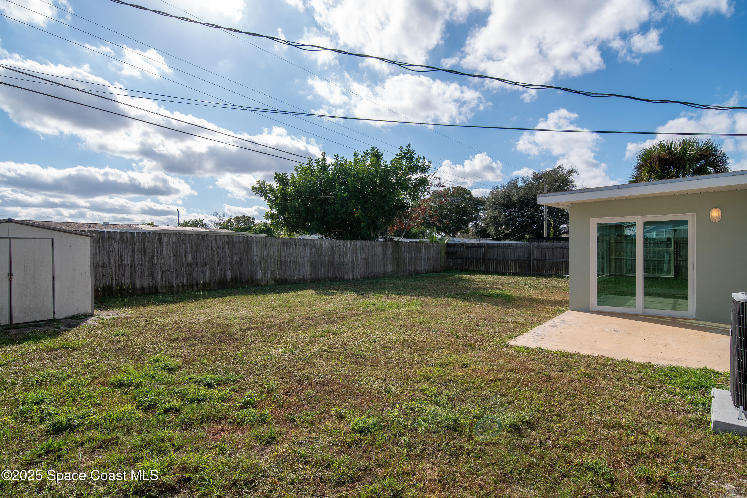 1705 Sarno Acc Melbourne, FL 32935 - Photo 25 of 40 a view of a backyard