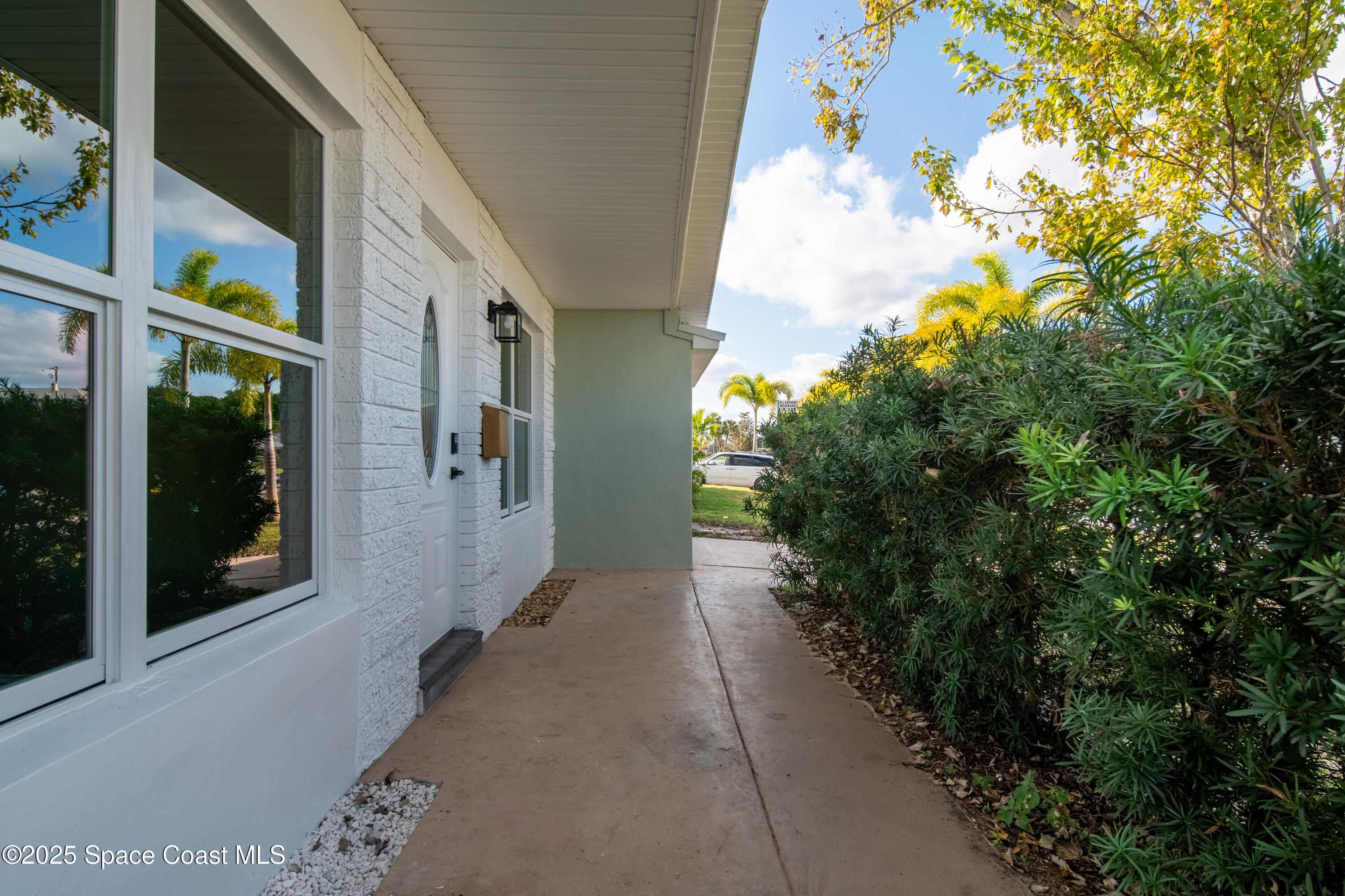 1705 Sarno Acc Melbourne, FL 32935 - Photo 8 of 40 a view of a pathway along with potted plants