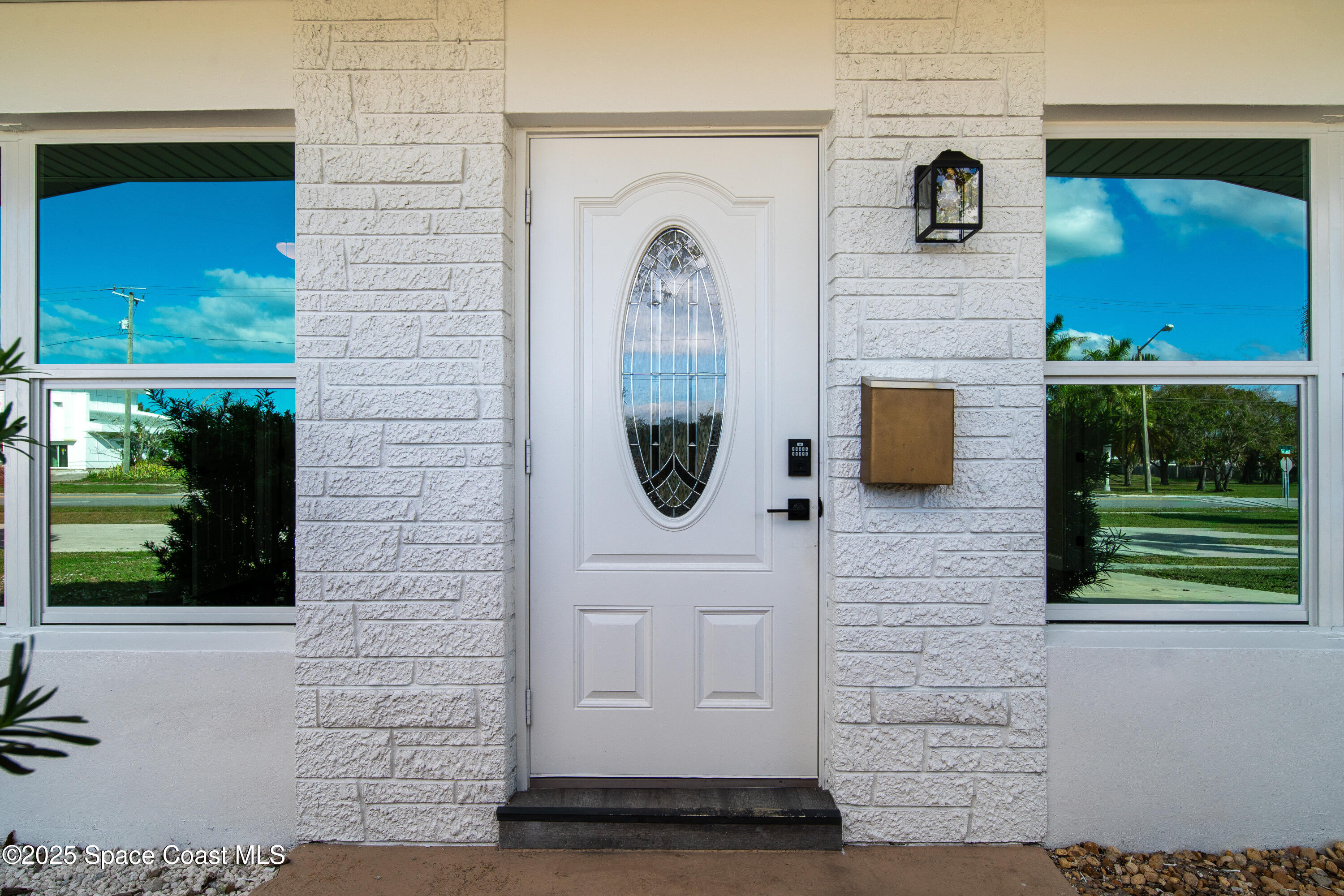 1705 Sarno Acc Melbourne, FL 32935 - Photo 10 of 40 a front view of a house with a garden