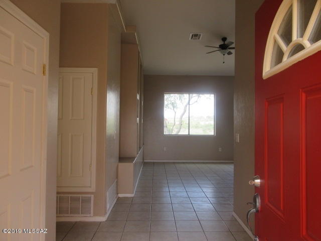965 Circulo Tumbleweed Rio Rico, AZ 85648 - Photo 3 of 18 a view of an empty room with a window