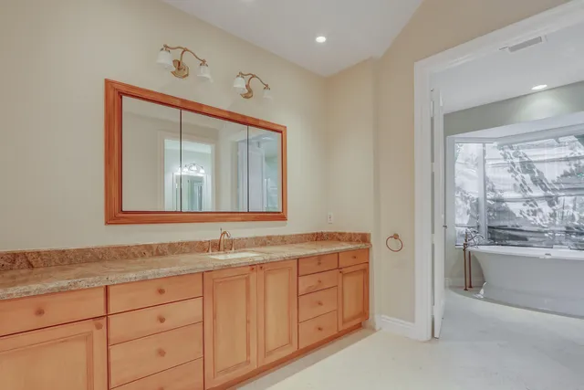 a bathroom with a bathtub and shower
