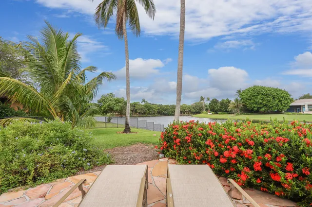 a view of an empty room with large windows