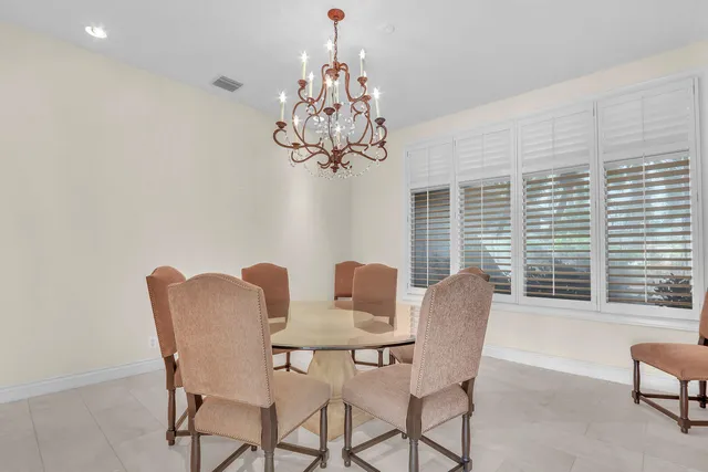 a large kitchen with granite countertop a sink and dishwasher a stove top oven with wooden floor