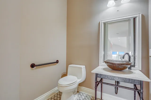 a kitchen with stainless steel appliances granite countertop a refrigerator a stove top oven a sink and dishwasher