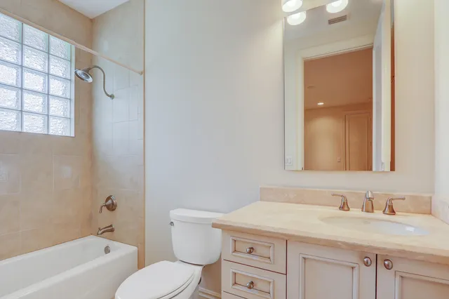 an aerial view of a house with a yard and garden