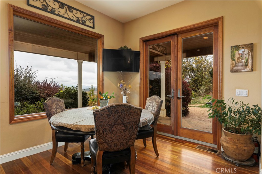8664 Seigler Springs Road Kelseyville, CA 95451 - Photo 11 of 75 a view of a dining room with furniture window and wooden floor