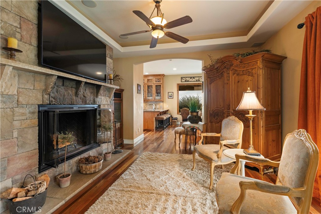 8664 Seigler Springs Road Kelseyville, CA 95451 - Photo 13 of 75 a living room with furniture a fireplace and a flat screen tv