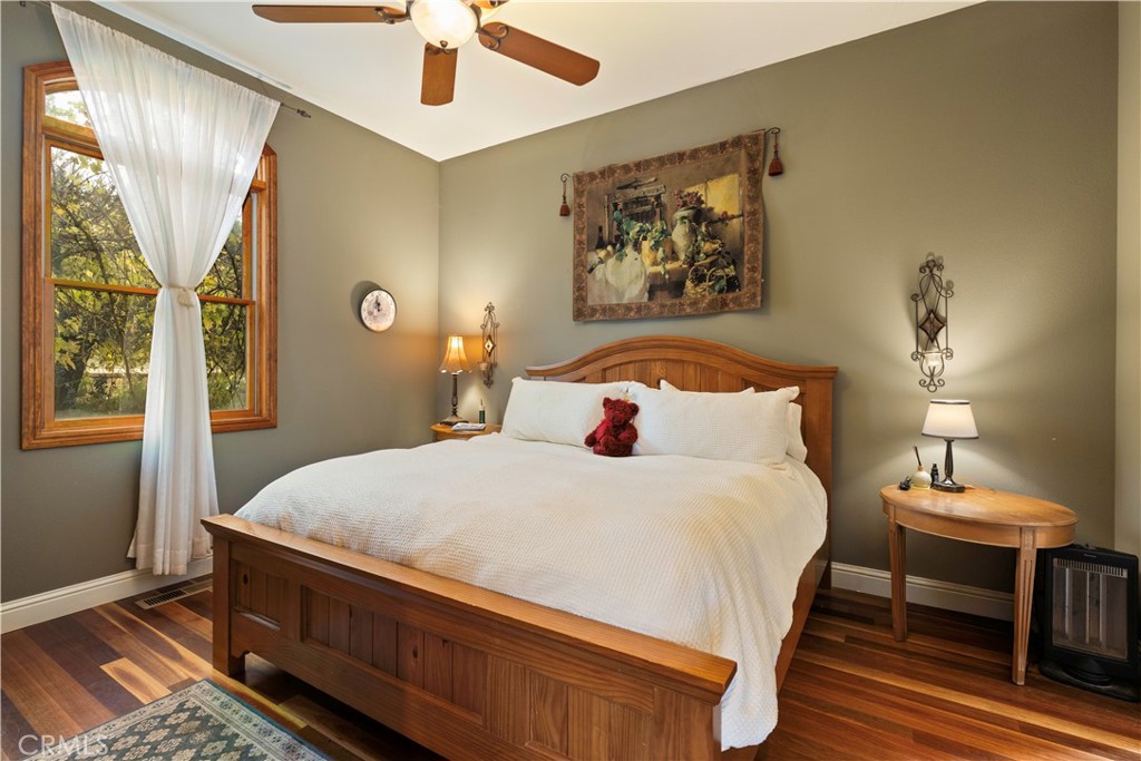 8664 Seigler Springs Road Kelseyville, CA 95451 - Photo 18 of 75 a bedroom with a bed and a table in it