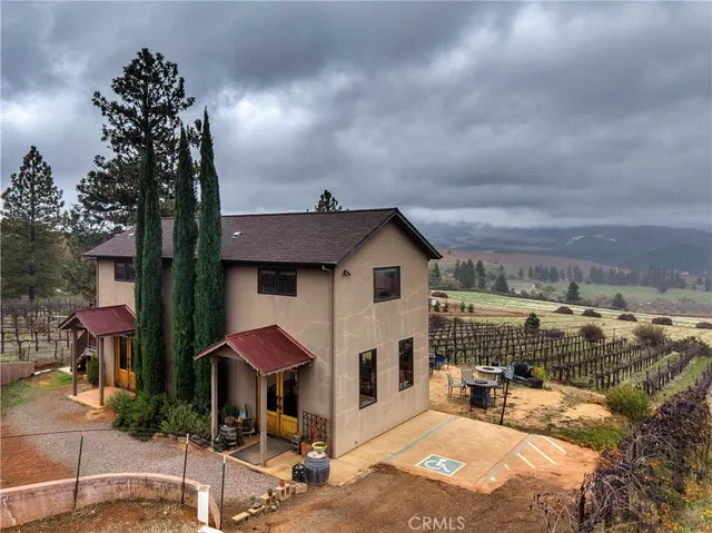 a front view of a house with sitting area