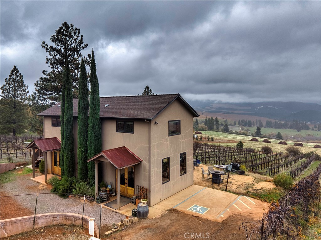 8664 Seigler Springs Road Kelseyville, CA 95451 - Photo 32 of 75 a front view of a house with yard and sitting area
