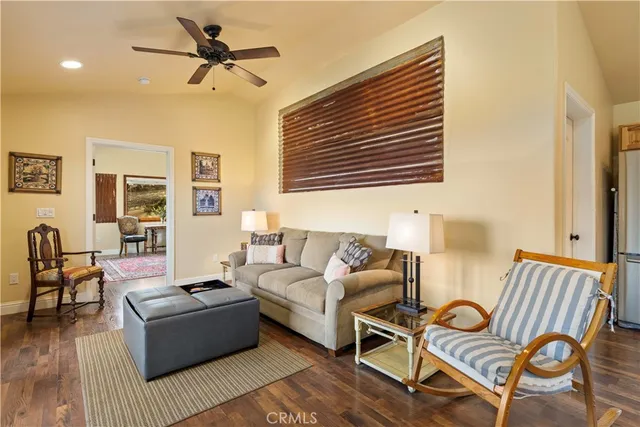 an aerial view of ocean and residential houses with outdoor space