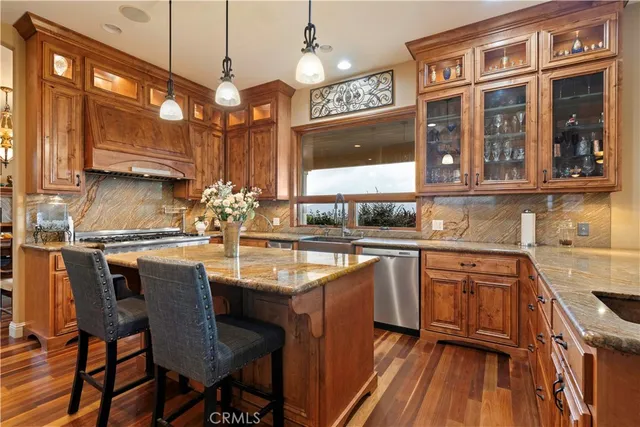 a kitchen that has a sink and a stove