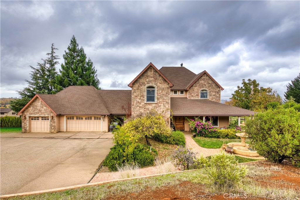 8664 Seigler Springs Road Kelseyville, CA 95451 - Photo 69 of 75 a front view of a house with a yard and trees