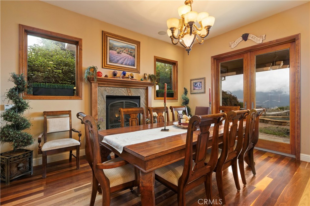8664 Seigler Springs Road Kelseyville, CA 95451 - Photo 9 of 75 a view of a dining room with furniture window and wooden floor