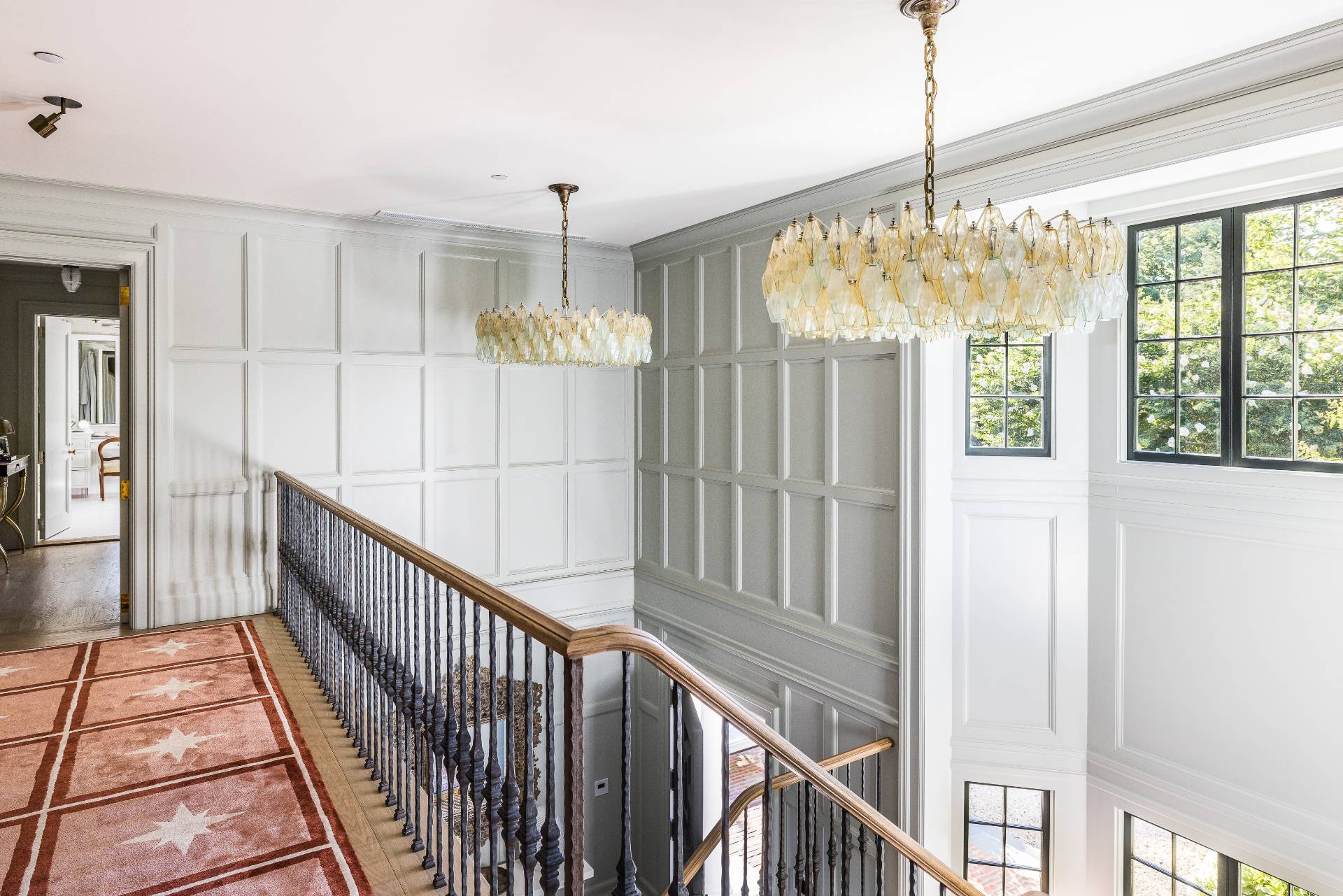 43 Lee Avenue East Hampton, NY 11937 - Photo 27 of 49 a view of an entryway with wooden floor and chandelier