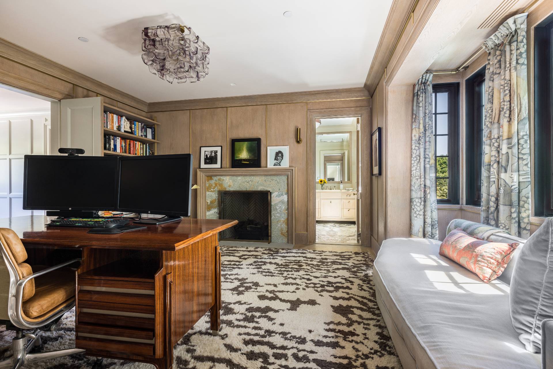 43 Lee Avenue East Hampton, NY 11937 - Photo 30 of 49 a livingroom with furniture a flat screen tv and a fireplace