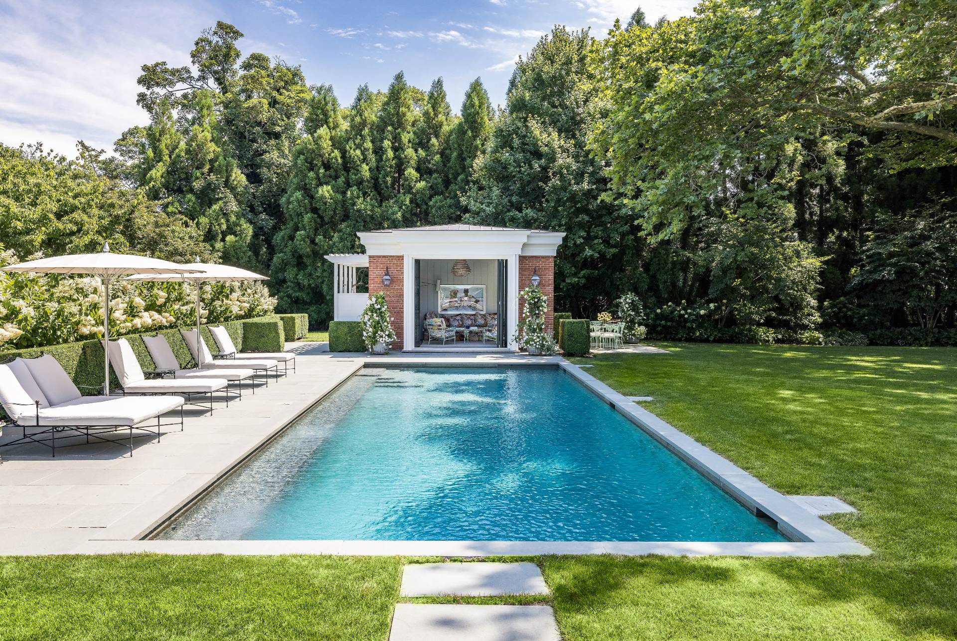 43 Lee Avenue East Hampton, NY 11937 - Photo 4 of 49 a view of a house with swimming pool