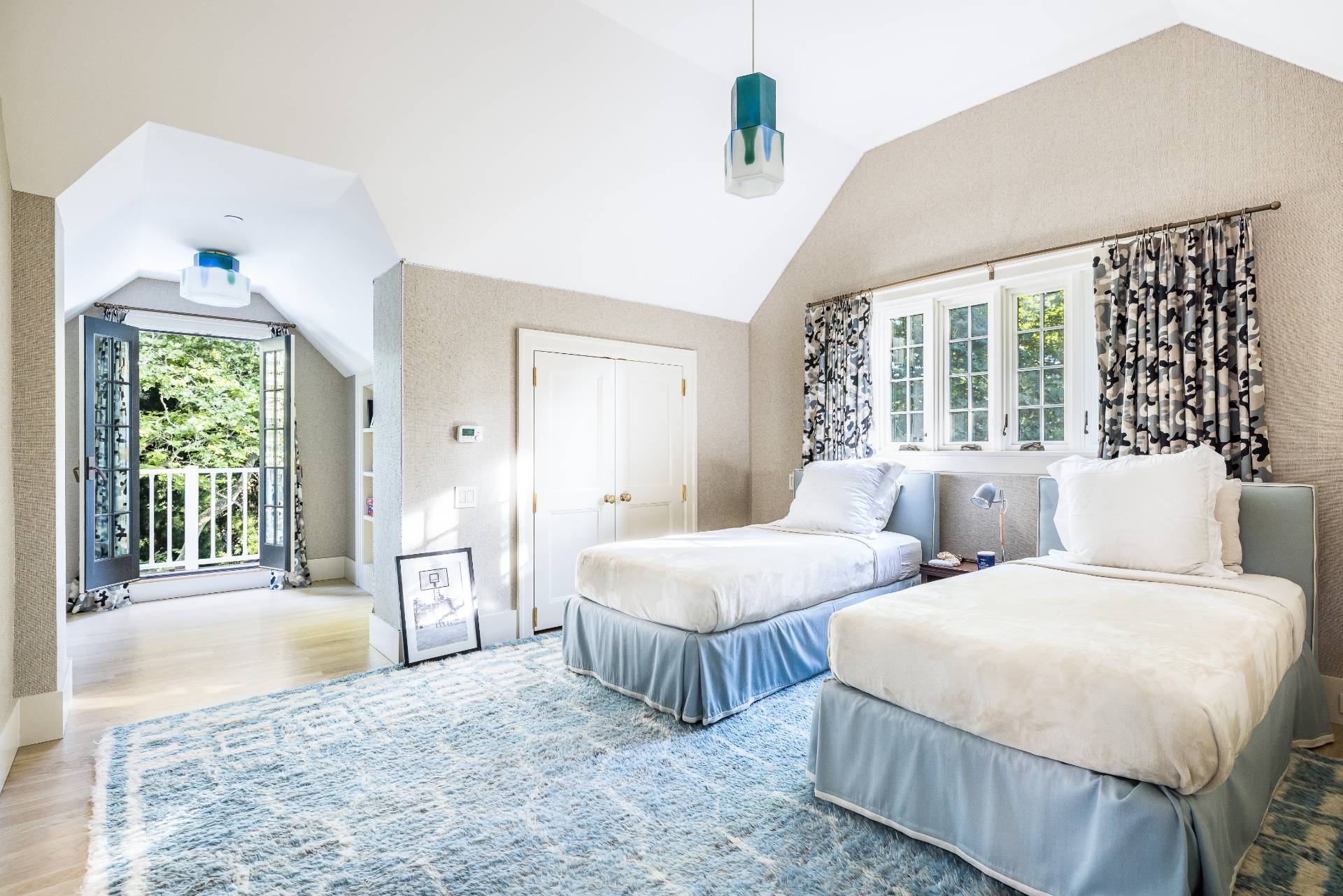 43 Lee Avenue East Hampton, NY 11937 - Photo 43 of 49 a spacious bedroom with two beds and a large window