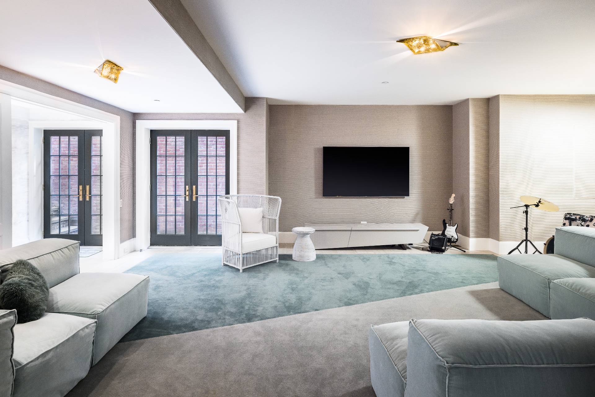 43 Lee Avenue East Hampton, NY 11937 - Photo 45 of 49 a living room with furniture and a flat screen tv