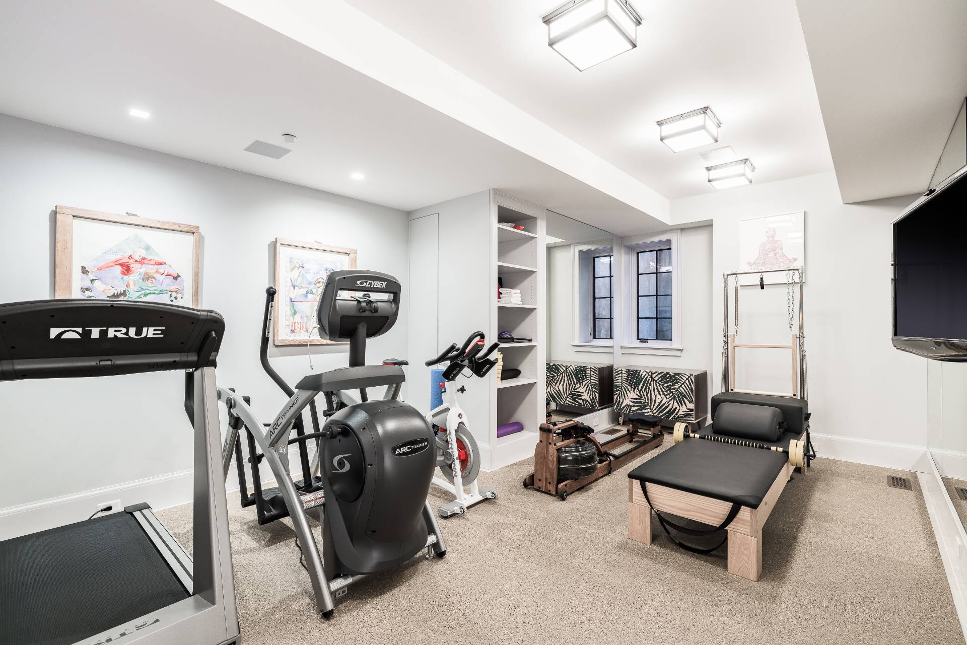 43 Lee Avenue East Hampton, NY 11937 - Photo 47 of 49 a living room with furniture a flat screen tv and a window