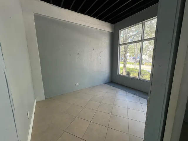 a view of an empty room with a window