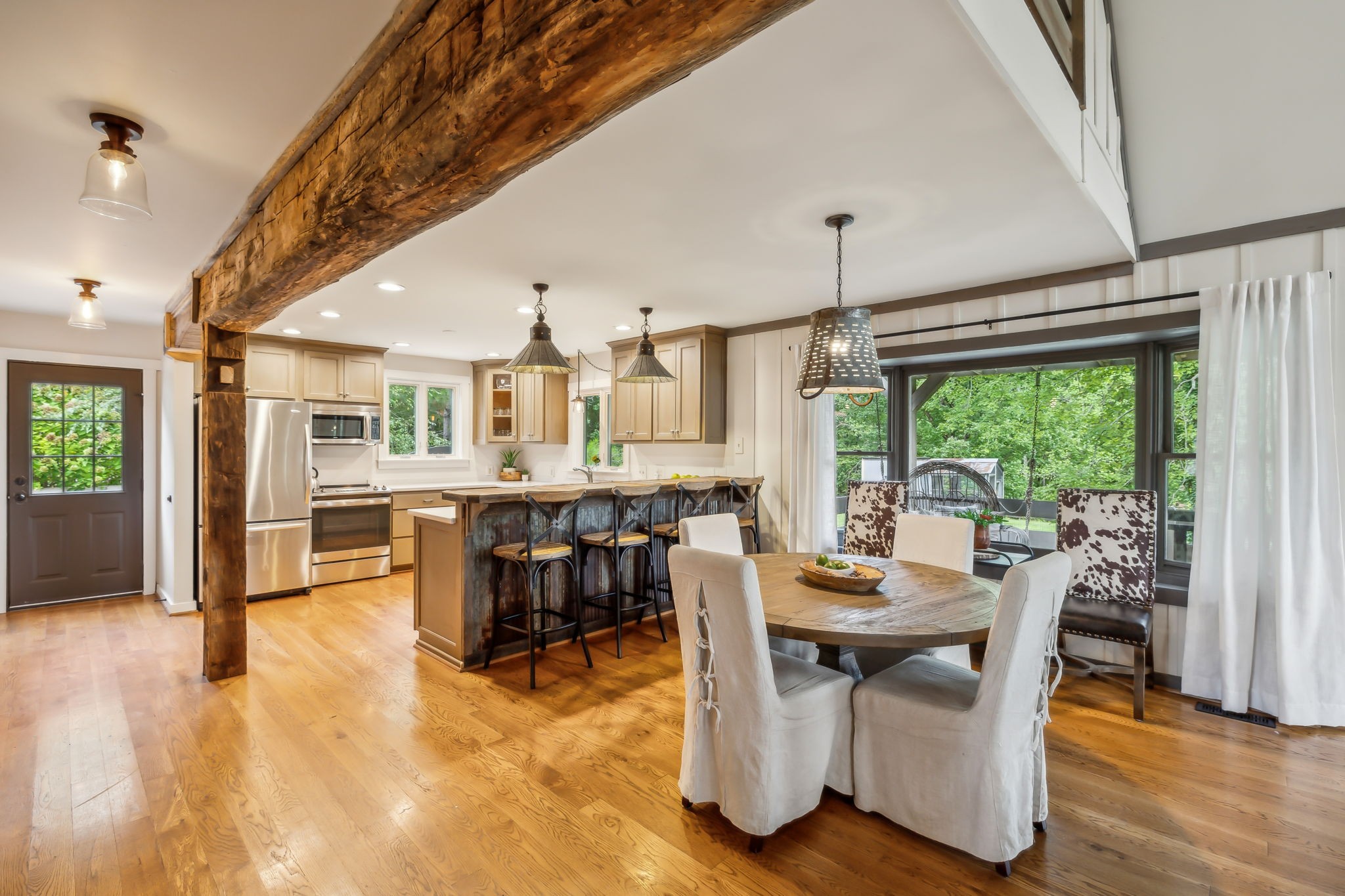 7296 Deer Ridge Road Fairview, TN 37062 - Photo 29 of 61 a view of a dining room with furniture window and wooden floor