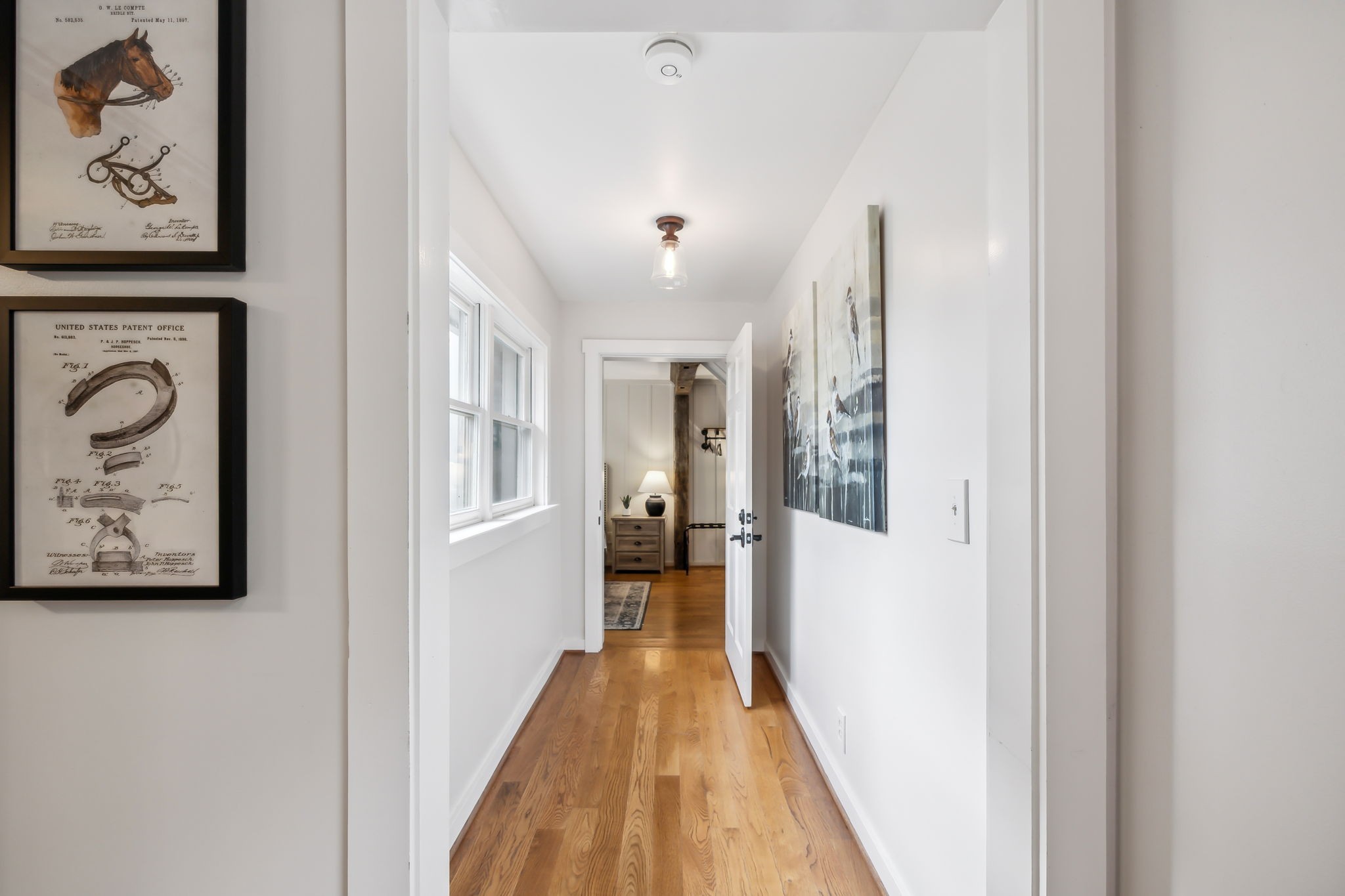 7296 Deer Ridge Road Fairview, TN 37062 - Photo 36 of 61 a view of a hallway with wooden floor and furniture