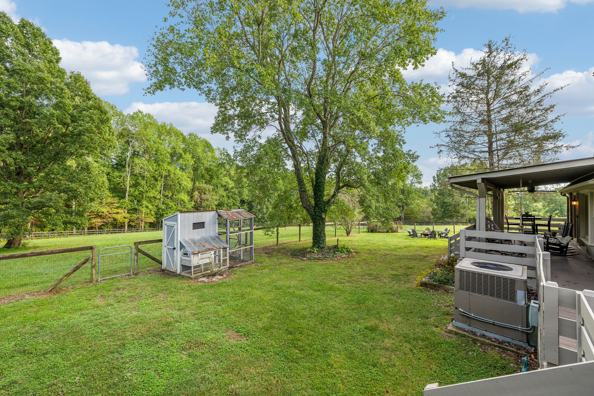 7296 Deer Ridge Road Fairview, TN 37062 - Photo 54 of 61 a backyard of a house with table and chairs