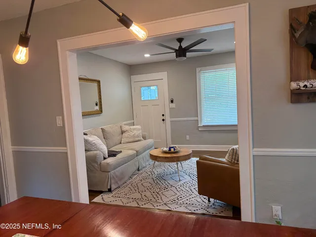 a kitchen with a refrigerator and a sink