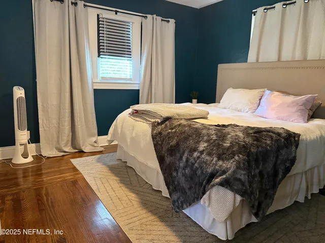 a view of a street with houses on both side