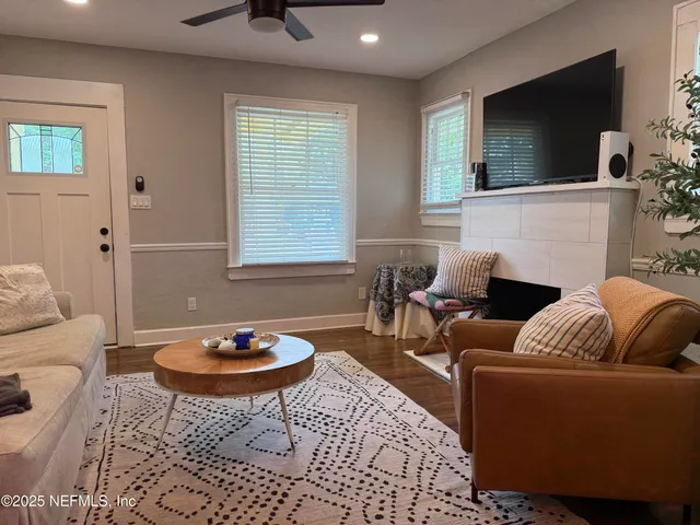 a living room with furniture and a rug