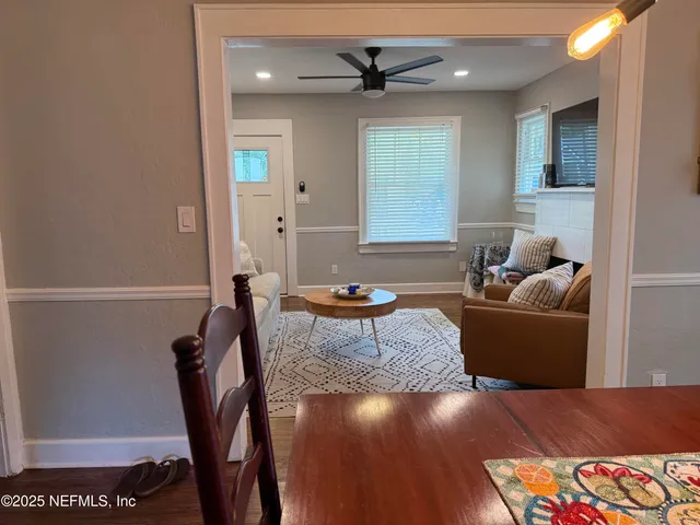 a kitchen with appliances a sink and cabinets