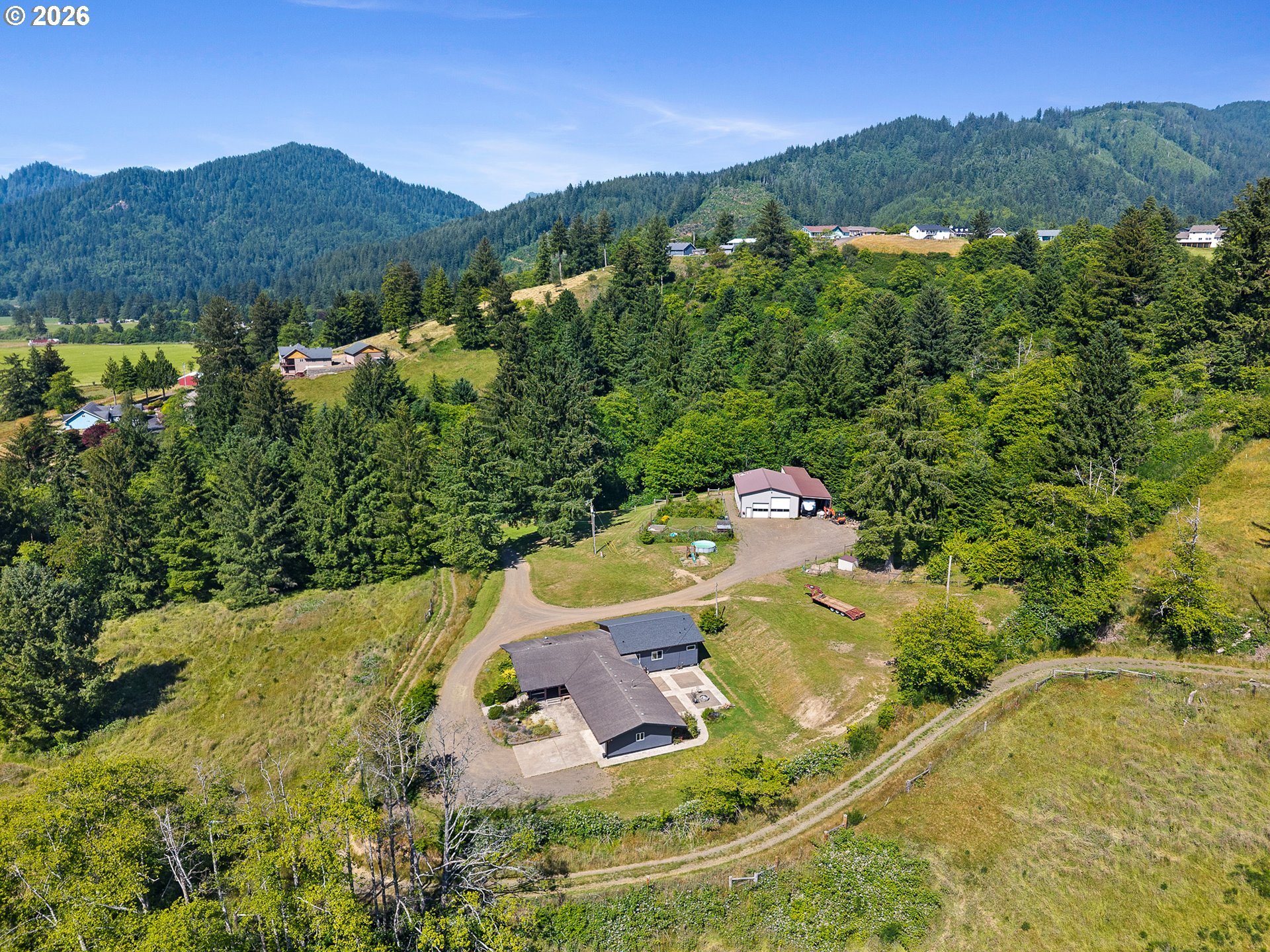 850 Hodgdon Road Tillamook, OR 97141 - Photo 3 of 43 a view of a swimming pool with a yard
