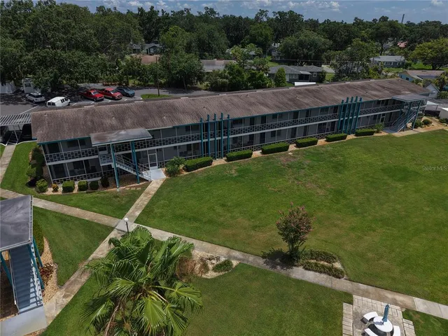 an aerial view of a house with a garden