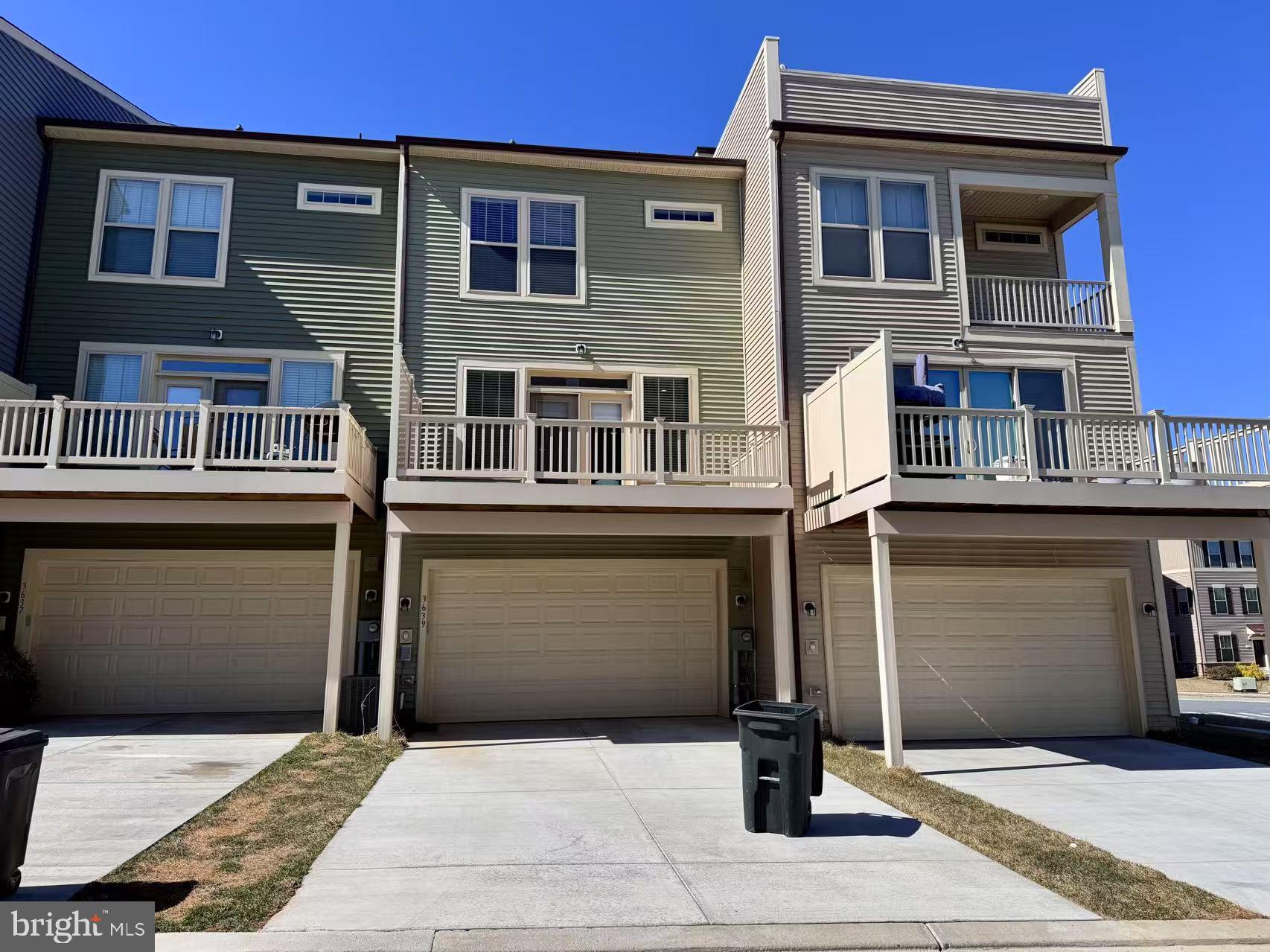 3639 Stone Barn Drive Frederick, MD 21704 - Photo 3 of 21 a front view of a building with a garden