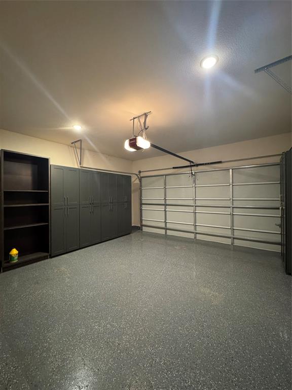 504 Evergreen Road Little Elm, TX 76227 - Photo 22 of 24 Garage with stroage and epoxy floors