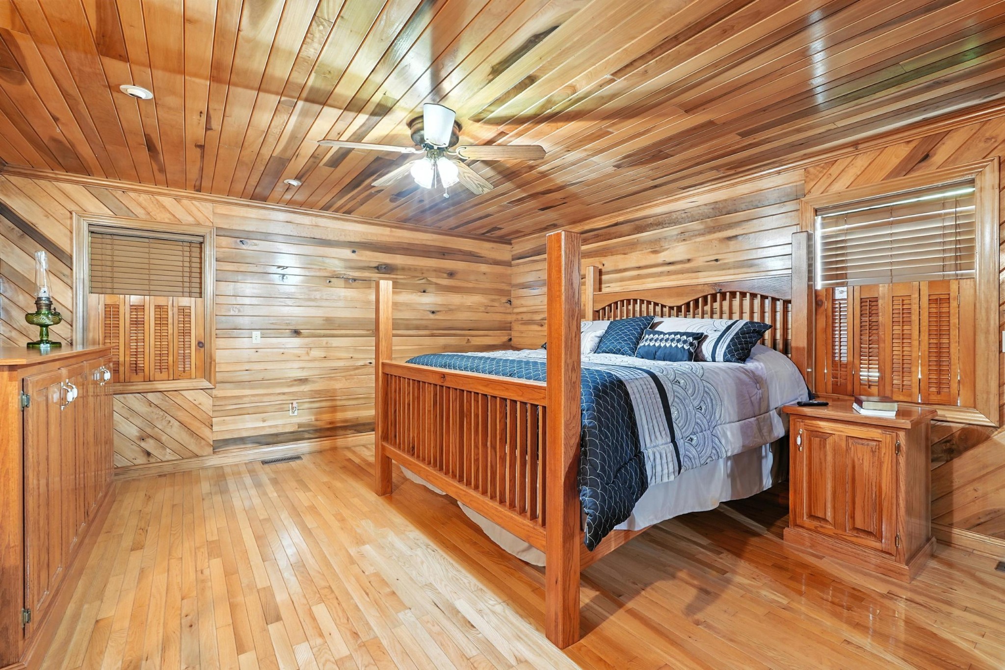 1880 Clydeton Road Waverly, TN 37185 - Photo 15 of 85 a view of a two room with wooden floor and iron stairs