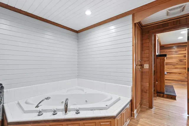 a view of a room with wooden walls