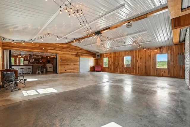 a kitchen with stainless steel appliances granite countertop lots of counter top space and wooden floor