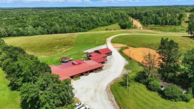 a spacious bathroom with a granite countertop sink and a large mirror