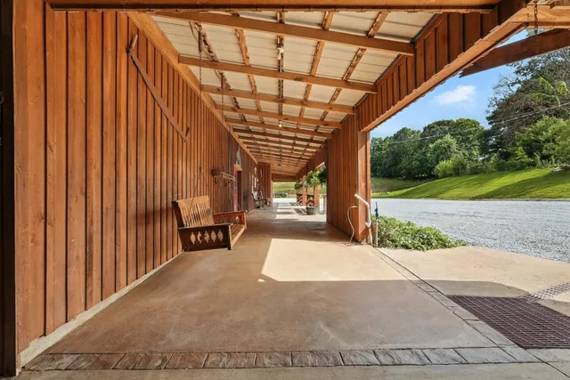 a bedroom with furniture and a wooden floor