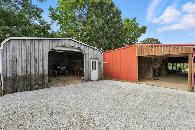 a bedroom with a bed and a view of balcony