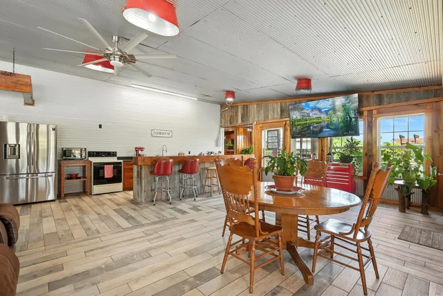 a view of porch with wooden stairs and a glass top table