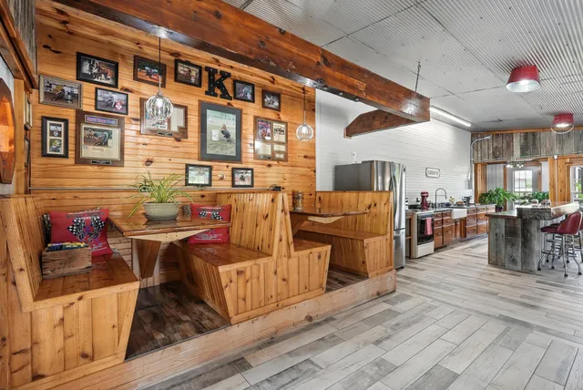 a view of a porch with furniture and garden view