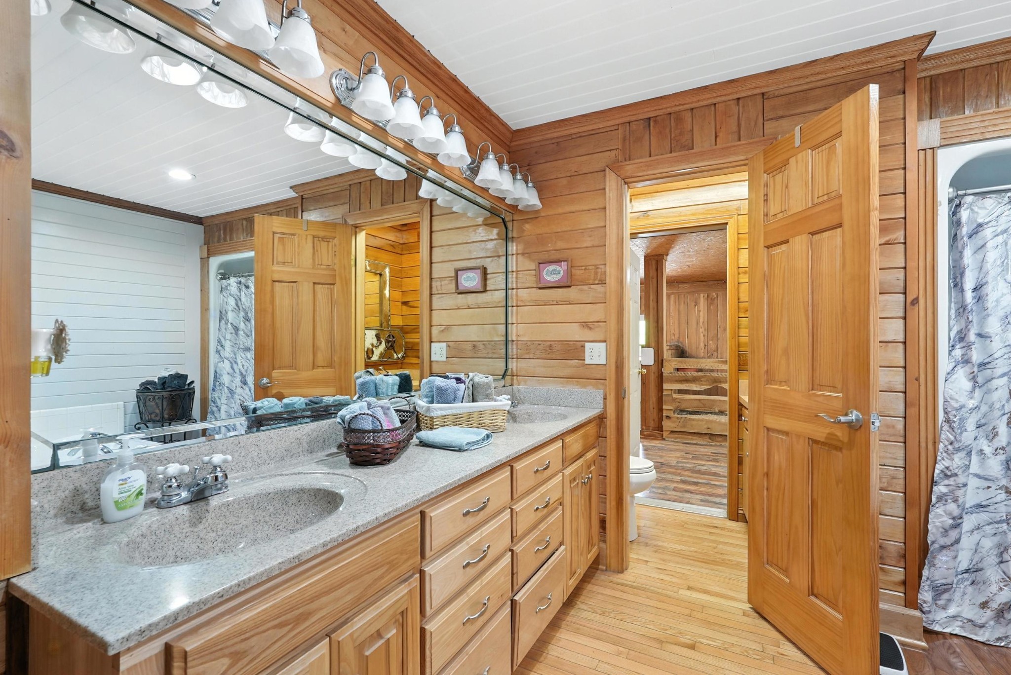 1880 Clydeton Road Waverly, TN 37185 - Photo 52 of 85 a bathroom with double vanity and a mirror