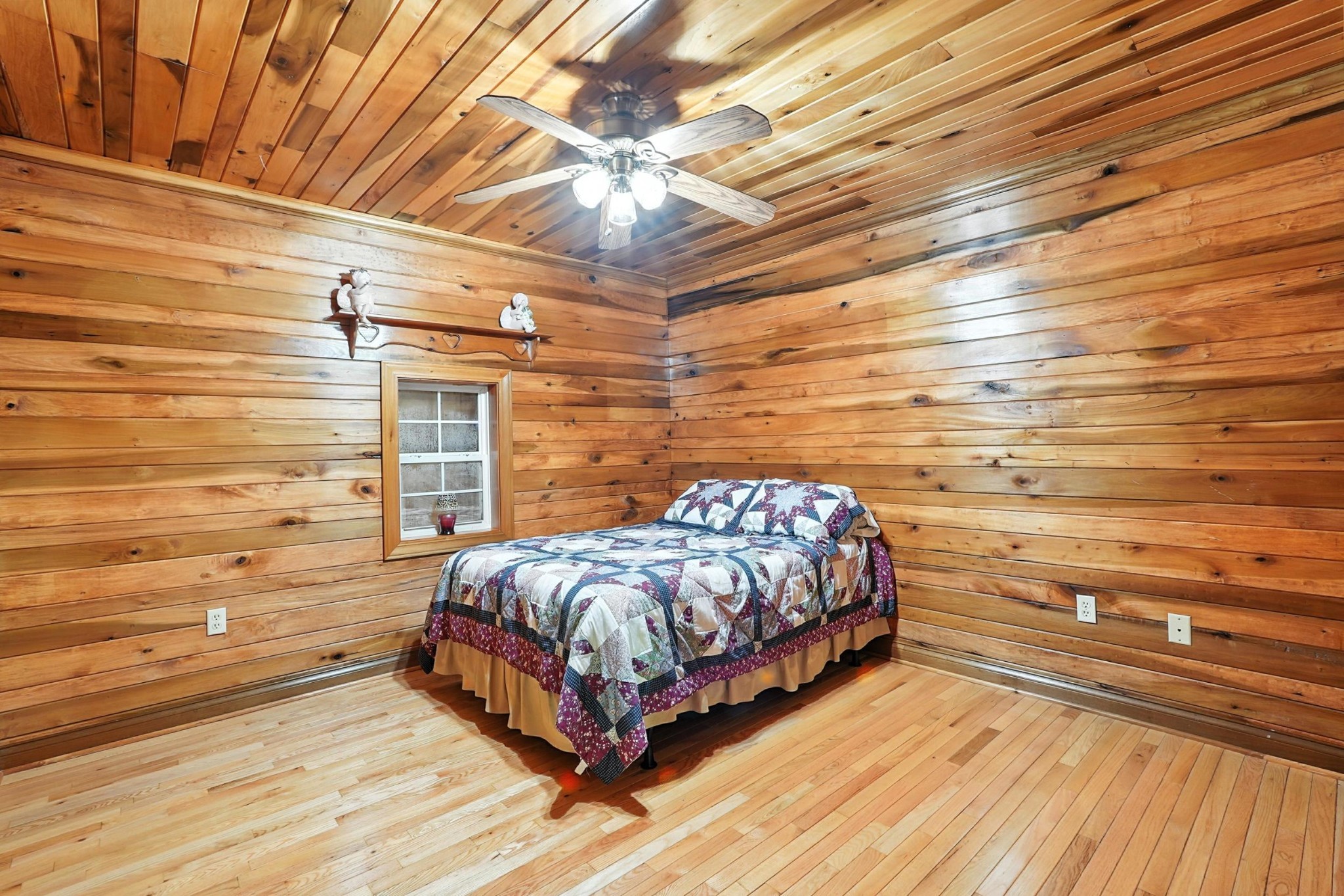 1880 Clydeton Road Waverly, TN 37185 - Photo 54 of 85 a bed sitting in a bedroom next to a cabinet