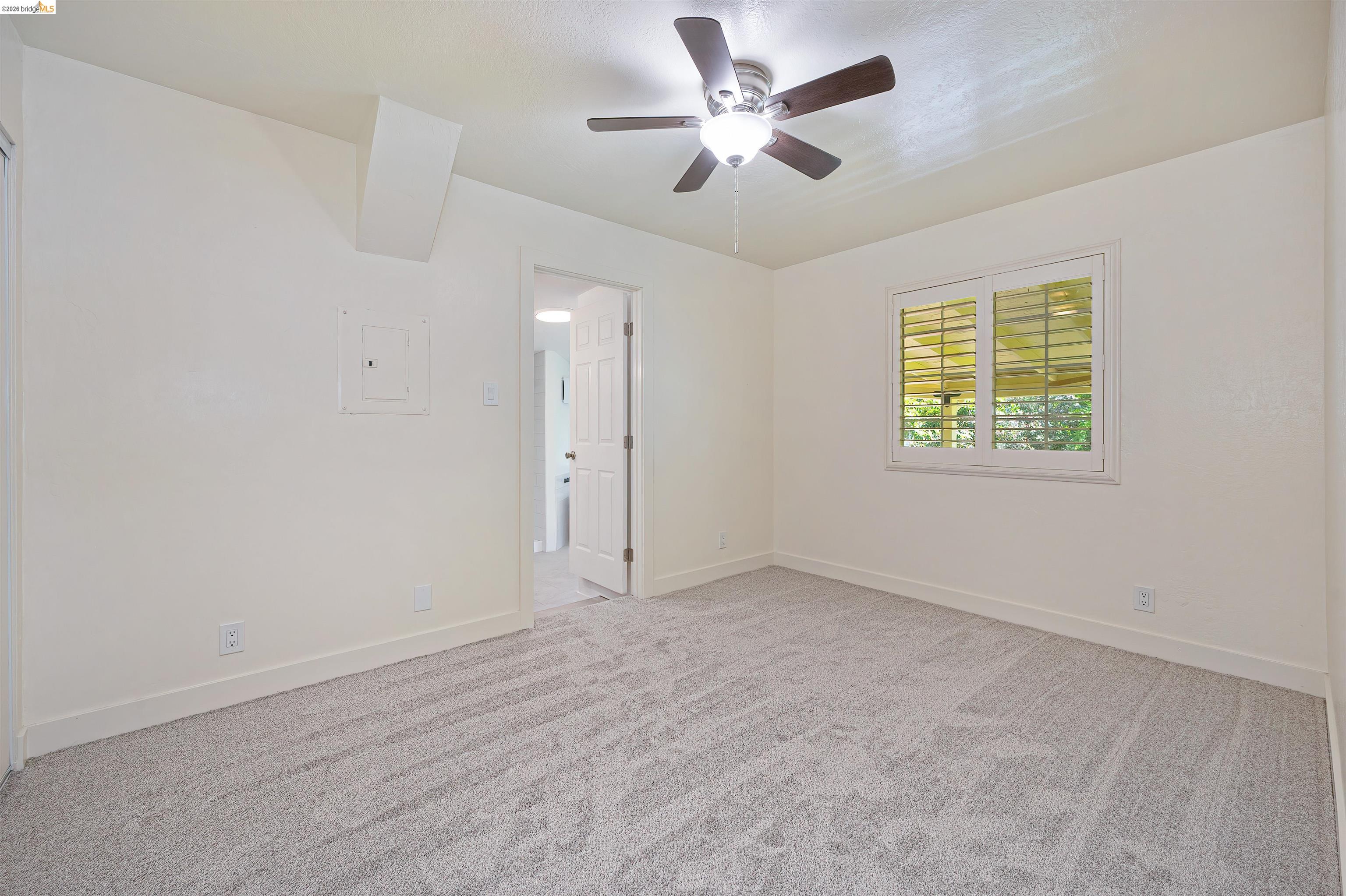 10474 Sheldon Road Elk Grove, CA 95624 - Photo 28 of 83 Carpeted room featuring a ceiling fan with light fixture, a window with horizontal blinds, and a white interior door